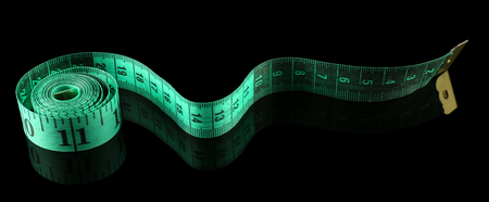Measuring tape on black background