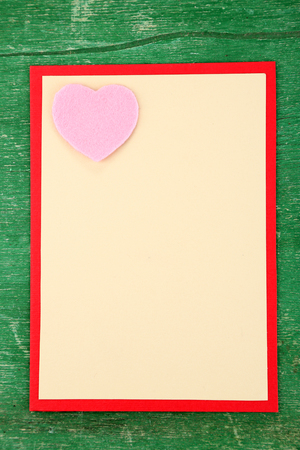 Beautiful hand made post card on color wooden backgroundの写真素材