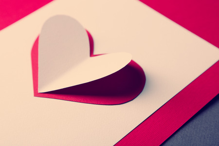 Beautiful paper heart on paper background, close-upの写真素材