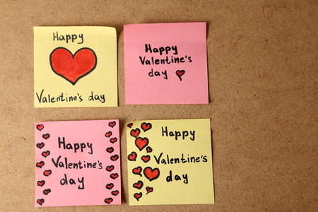 Valentines day notes on wooden backgroundの写真素材