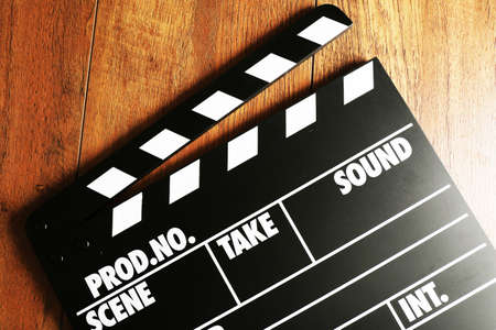 Movie clapper on wooden backgroundの写真素材