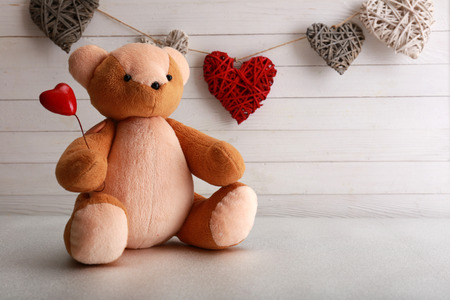 Teddy bear with hearts, love conceptの写真素材