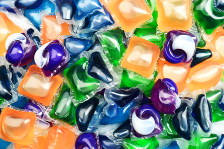 Gel capsules with laundry detergent close up