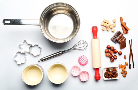 Food ingredients and kitchen utensils for cooking isolated on whiteの写真素材