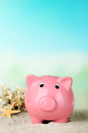 Piggy bank on the beachの写真素材