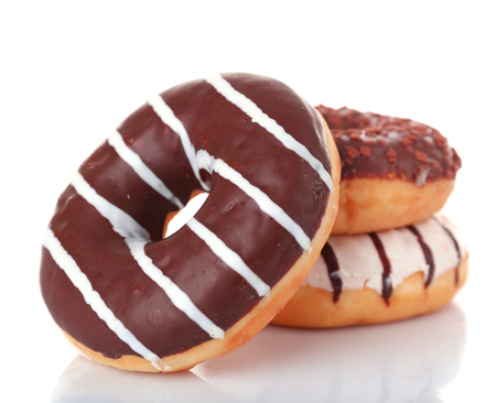 Delicious donuts with icing isolated on whiteの写真素材