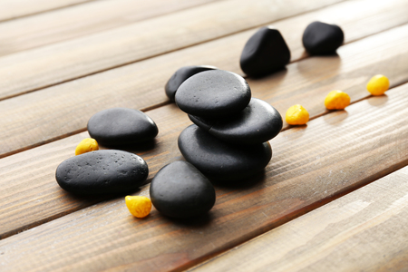 Spa stones drops on wooden backgroundの写真素材