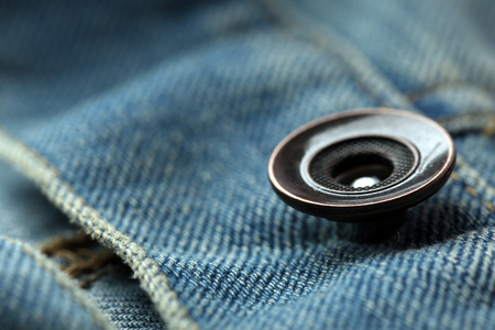 Metal button on clothes close upの写真素材