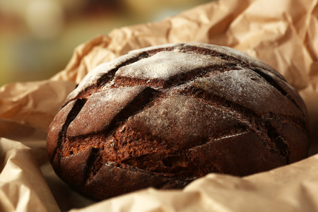 Fresh bread on paper close upの写真素材