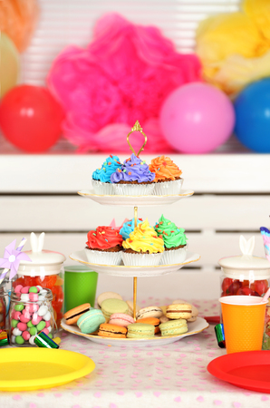 Prepared birthday table with sweets for children partyの写真素材