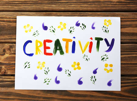 Word creativity written on paper on wooden backgroundの写真素材