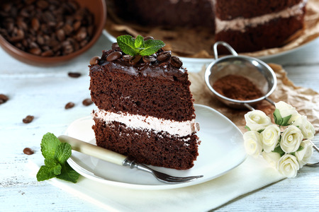 Delicious chocolate cake on table close-up