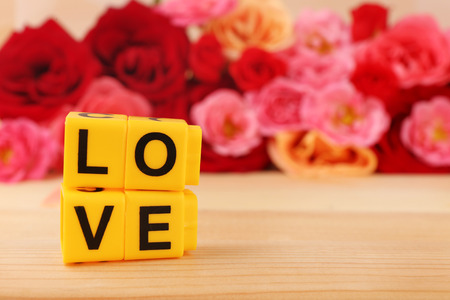 Decorative letters forming word LOVE with flowers on bright backgroundの写真素材