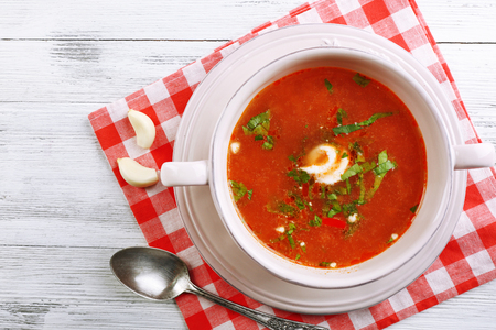 Ukrainian beetroot soup - borscht, on napkin, on wooden backgroundの写真素材