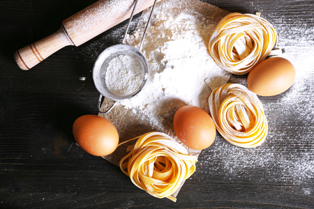 Still life of preparing pasta on rustic wooden backgroundの写真素材