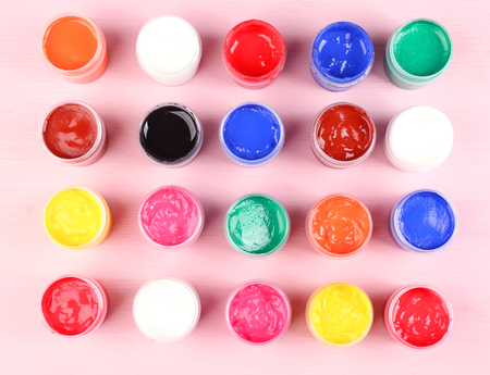 Colorful paint on pink background