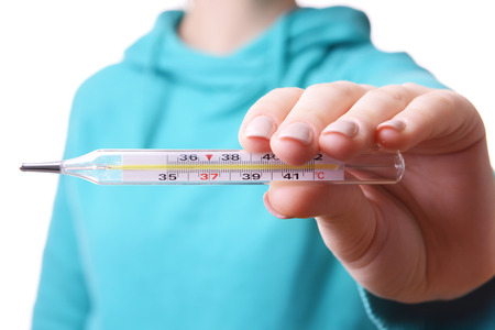 woman holding thermometer close upの写真素材