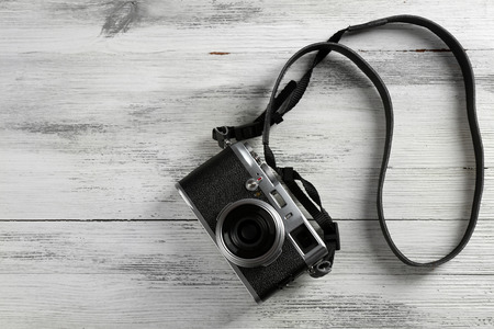 Old retro camera on wooden backgroundの写真素材
