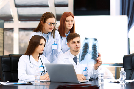 Medical workers working in conference room