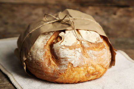 Fresh bread on old wooden table