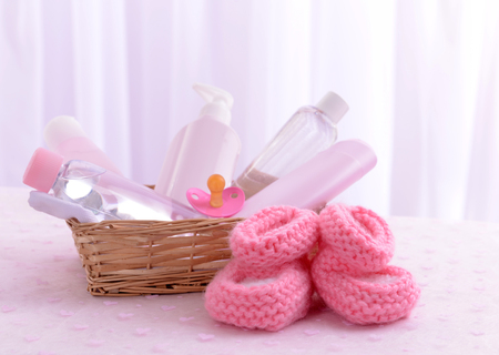 Baby accessories for bathing on table on light backgroundの写真素材