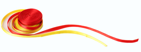 Colorful red and yellow ribbons isolated on whiteの写真素材