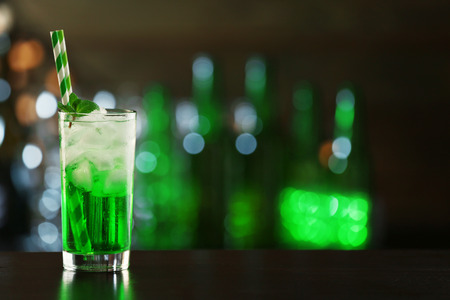 Green cocktail on table on dark backgroundの写真素材
