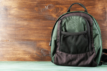 Backpack on wooden backgroundの写真素材