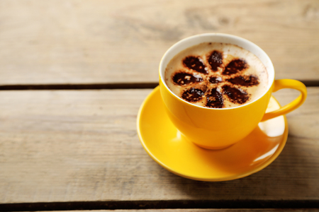 Cup of coffee on old wooden tableの写真素材