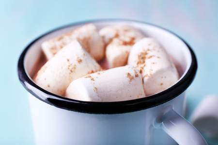 Mug of cocoa with marshmallows on wooden table, closeupの写真素材