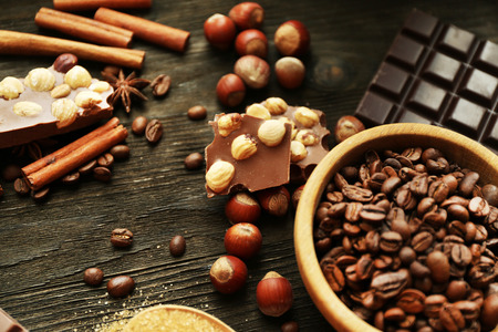 Still life with set of chocolate, nuts and spices on wooden table, closeupの写真素材