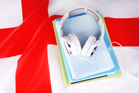 Books and headphones on England flag backgroundの写真素材