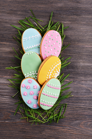 Delicious Easter cookies on wooden backgroundの写真素材