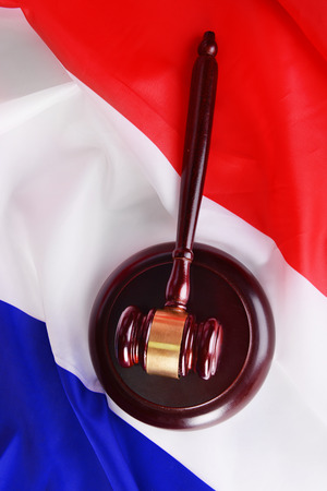 Wooden gavel on French flag backgroundの写真素材