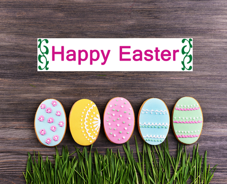 Delicious Easter cookies on wooden background