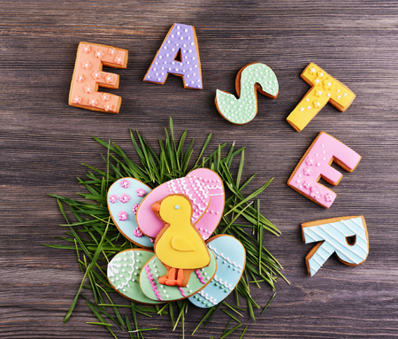 Delicious Easter cookies on wooden backgroundの写真素材