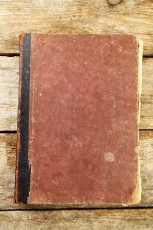 Old book on wooden tableの写真素材