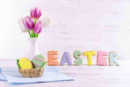 Delicious Easter cookies on table on light background