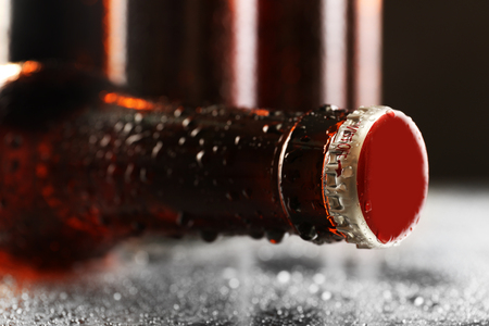 Glass bottles of beer on dark backgroundの写真素材