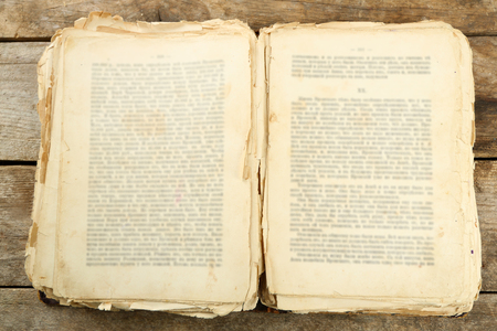 Old book on wooden tableの写真素材