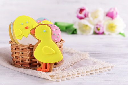 Delicious Easter cookies on table on light backgroundの写真素材