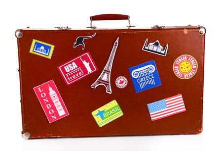 Suitcase with stickers isolated on whiteの写真素材