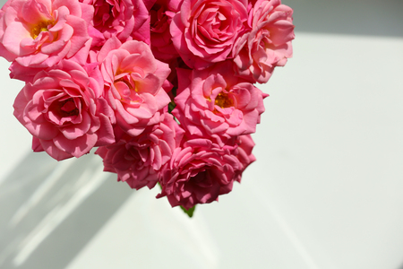 Bouquet of beautiful fresh roses on windowsill, closeupの写真素材