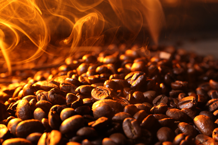 Pile of coffee beans with steam, closeupの写真素材