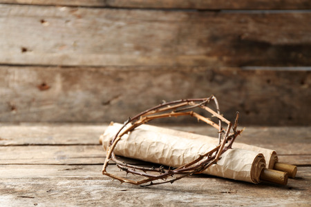 Crown of thorns and scroll on old wooden backgroundの写真素材