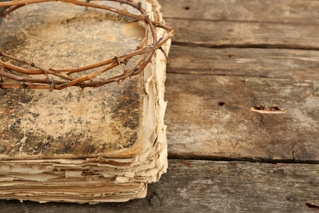 Crown of thorns and bible on old wooden backgroundの写真素材