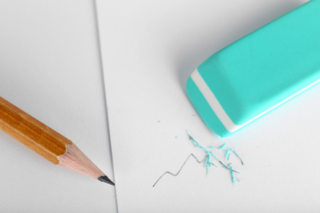 Eraser and pencil on paper backgroundの写真素材