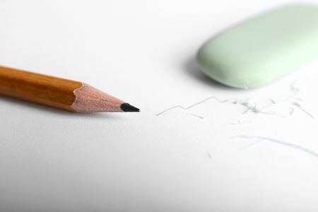 Eraser and pencil on paper backgroundの写真素材