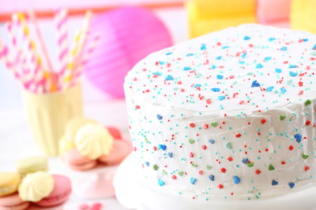Birthday decorated cake on colorful backgroundの写真素材