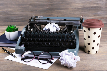 Retro typewriter on wooden backgroundの写真素材